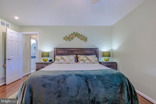bedroom with visible vents, baseboards, recessed lighting, and wood finished floors