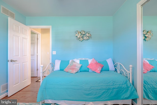 bedroom featuring light hardwood / wood-style floors