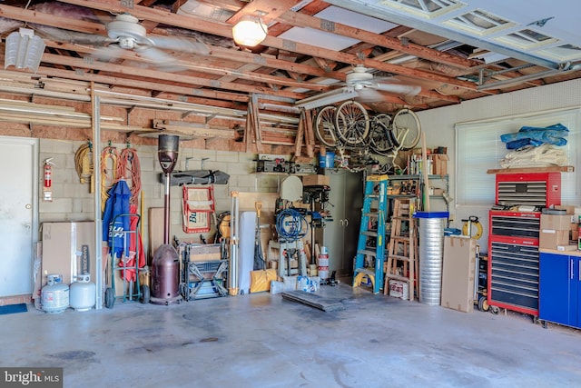 garage featuring a ceiling fan and a workshop area