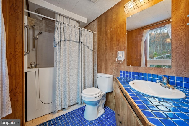 bathroom featuring tile patterned floors, a shower with curtain, wood walls, and toilet