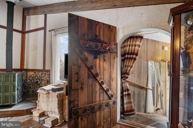 interior space with beamed ceiling and wood-type flooring