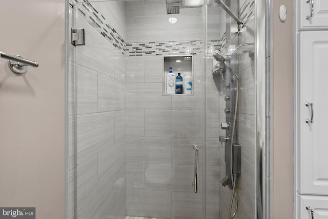 bathroom featuring an enclosed shower