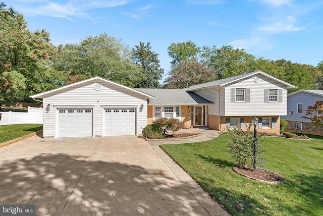 split level home featuring a garage and a front yard