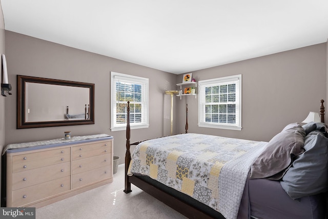 bedroom with light colored carpet