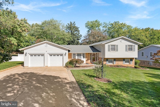 split level home featuring a front yard and a garage