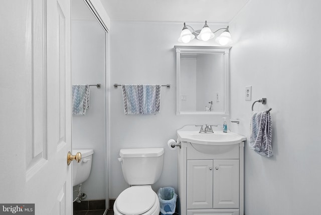 bathroom featuring vanity and toilet