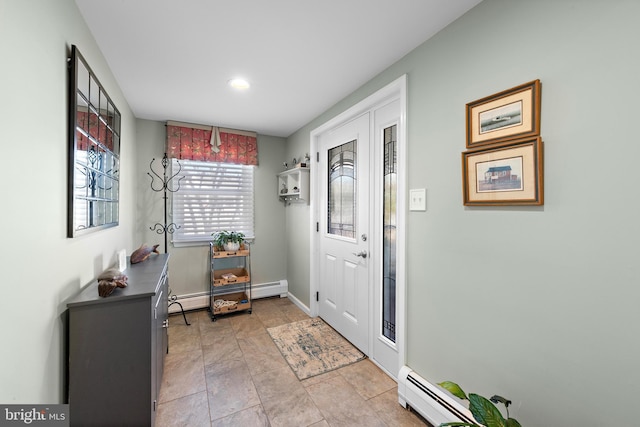 doorway to outside with a baseboard heating unit