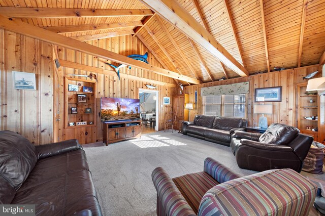 living room with carpet, lofted ceiling with beams, and wooden walls