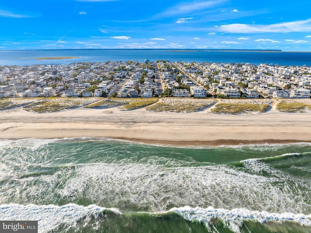 aerial view featuring a water view and a beach view