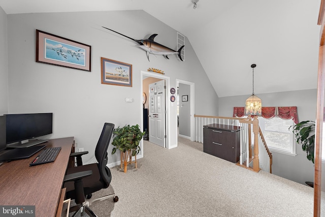 office featuring vaulted ceiling, a notable chandelier, and carpet floors