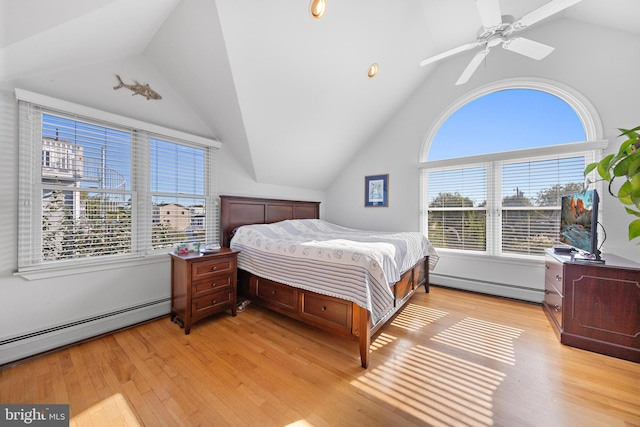 bedroom with light hardwood / wood-style flooring, lofted ceiling, a baseboard radiator, and ceiling fan