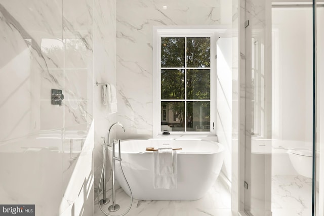 bathroom featuring tile walls, toilet, and plus walk in shower