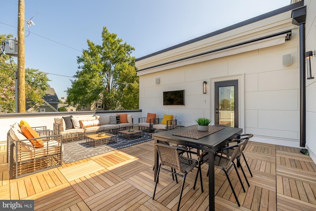 wooden terrace featuring outdoor lounge area