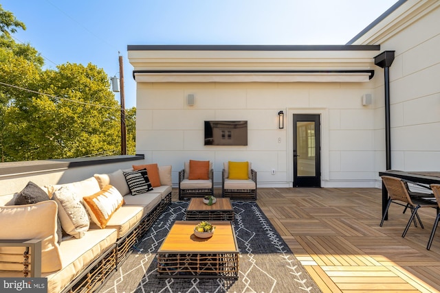 view of patio with an outdoor hangout area and a wooden deck