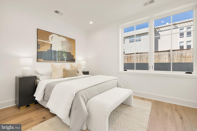 bedroom with wood-type flooring