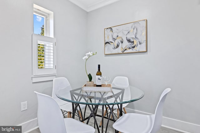 dining space featuring ornamental molding