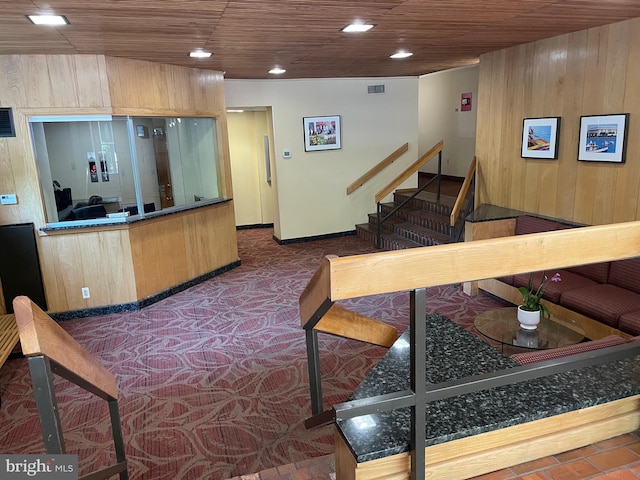 interior space with visible vents, wood ceiling, stairs, wood walls, and recessed lighting