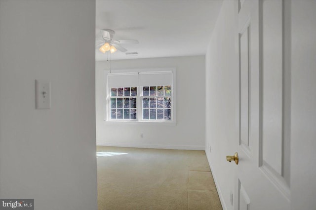 carpeted empty room with ceiling fan