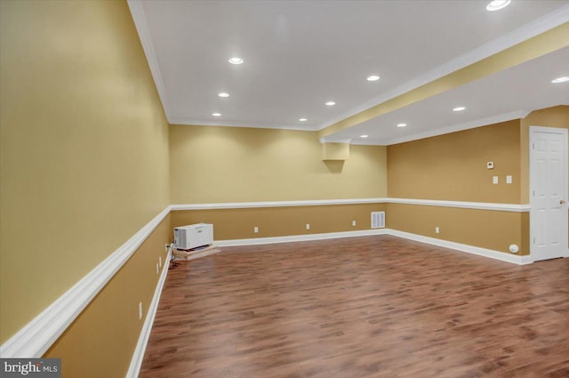 spare room with ornamental molding and hardwood / wood-style floors