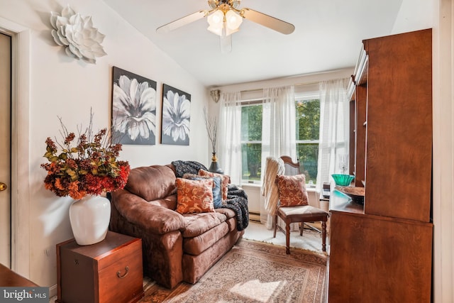 sitting room featuring vaulted ceiling and ceiling fan