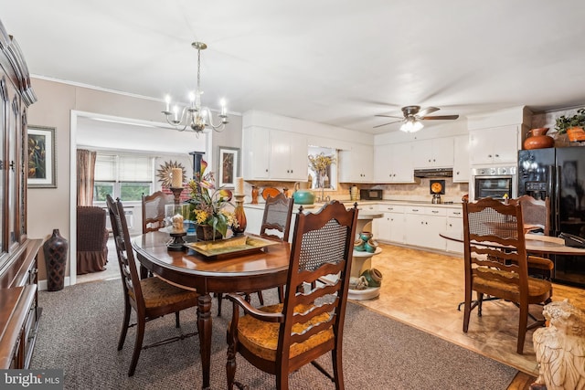 tiled dining space featuring ornamental molding and ceiling fan with notable chandelier