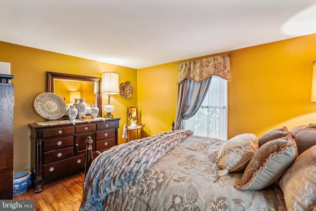 bedroom with hardwood / wood-style flooring