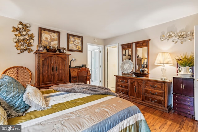 bedroom with hardwood / wood-style flooring