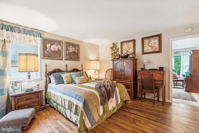 bedroom with hardwood / wood-style floors