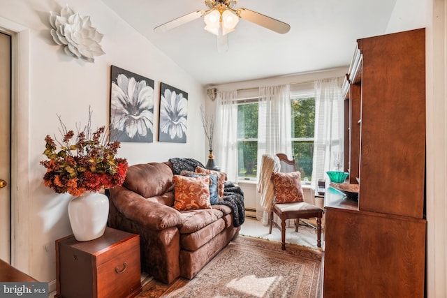 sitting room featuring ceiling fan and lofted ceiling