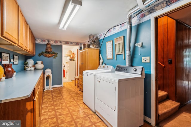 laundry area with cabinets, independent washer and dryer, and light parquet floors