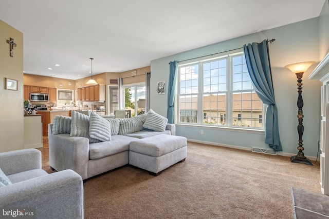 living room featuring light carpet