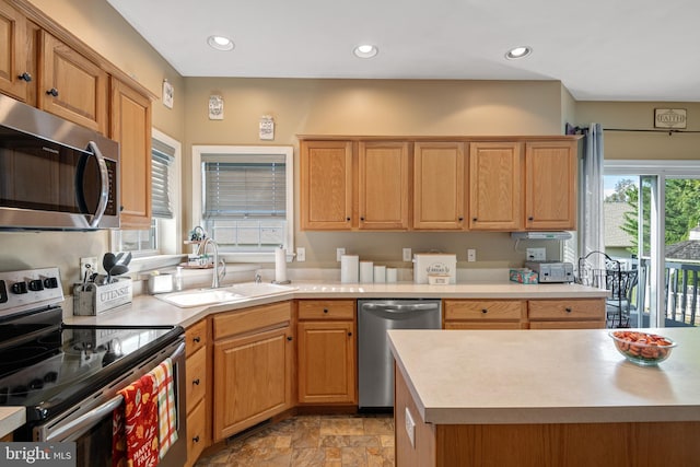 kitchen featuring stainless steel appliances and sink