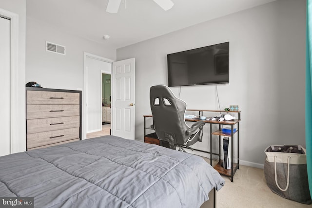 bedroom featuring ceiling fan and carpet