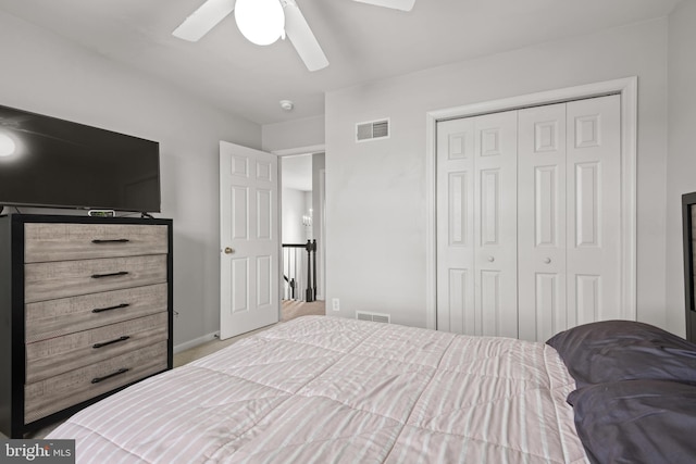 bedroom with ceiling fan and a closet