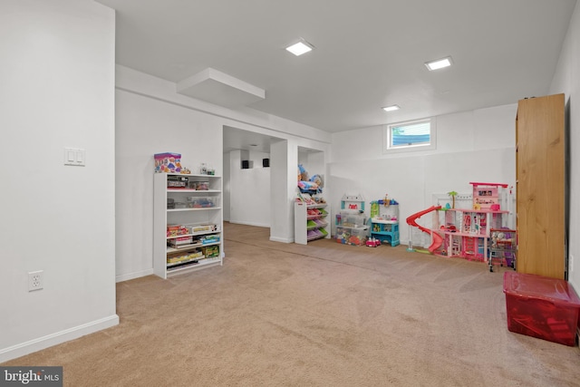 recreation room with carpet flooring