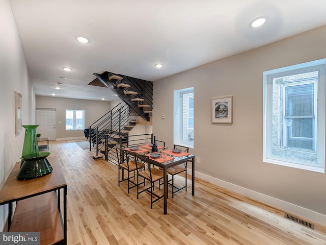 dining space featuring light hardwood / wood-style floors