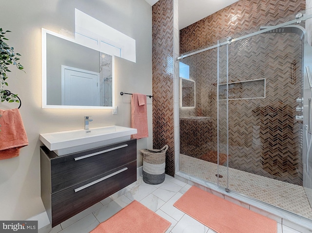 bathroom featuring tile patterned floors, walk in shower, and vanity