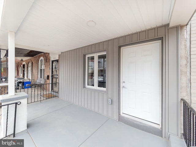 doorway to property with a porch