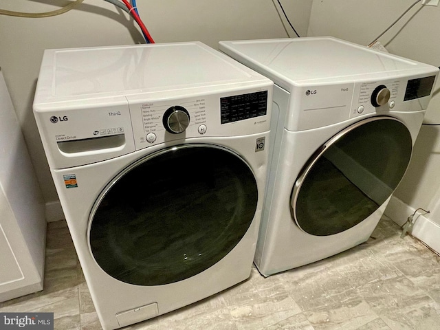 laundry room with washer and clothes dryer