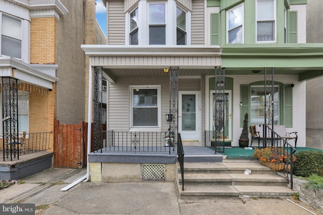 doorway to property featuring covered porch