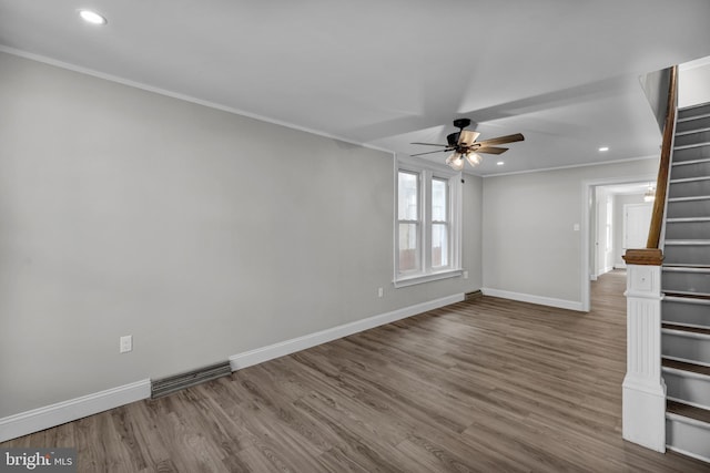 unfurnished living room with crown molding, ceiling fan, and hardwood / wood-style floors