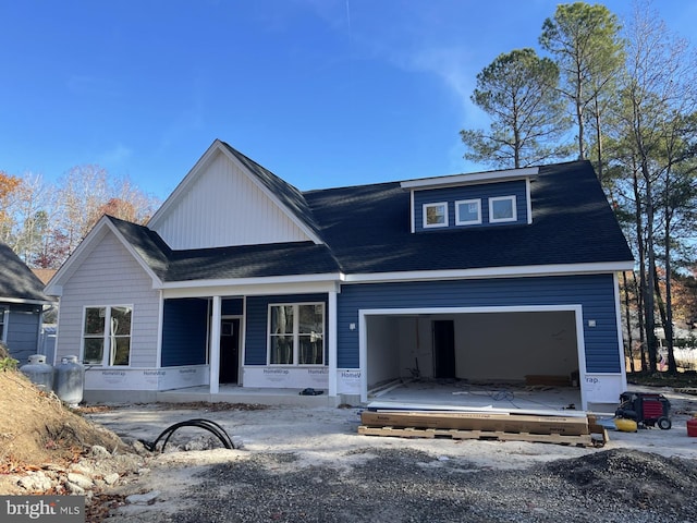 view of front facade with a porch and a garage