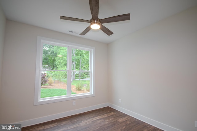 1 Tiller Ln, Ocean Pines, MD 21811 - empty room with healthy amount of natural light, baseboards, dark wood-type flooring, and a ceiling fan