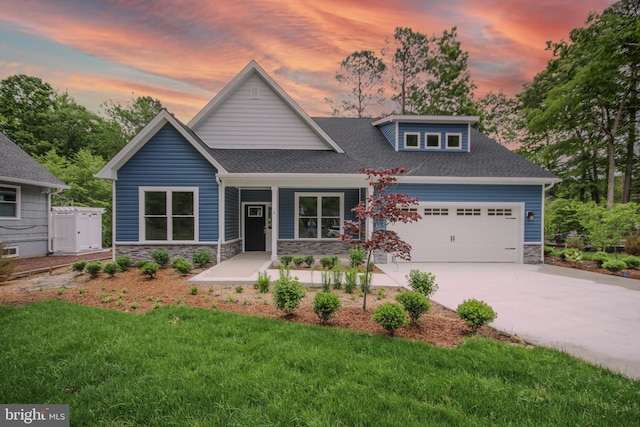 1 Tiller Ln, Ocean Pines, MD 21811 - view of front facade featuring stone siding, an attached garage, driveway, covered porch, and a front yard