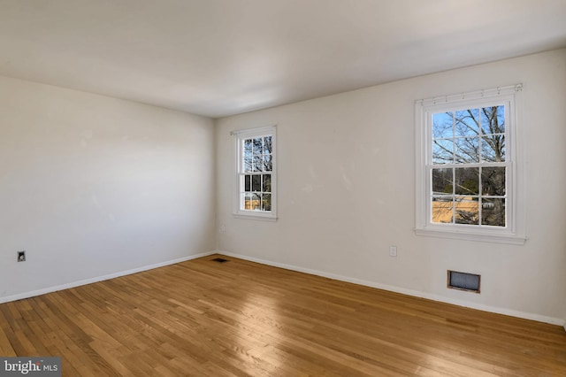 empty room featuring hardwood / wood-style flooring