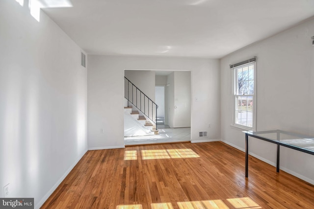 unfurnished room featuring light hardwood / wood-style floors