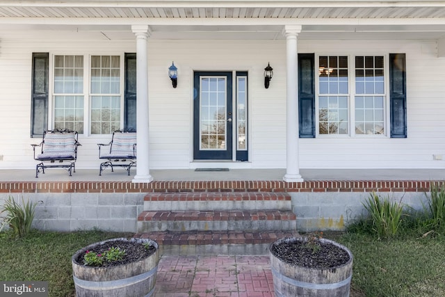 entrance to property with a porch