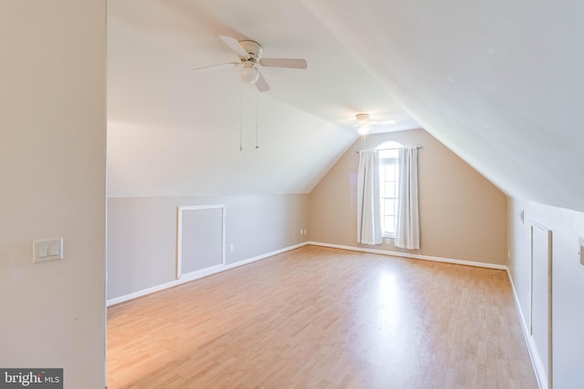 bonus room with lofted ceiling, light hardwood / wood-style floors, and ceiling fan