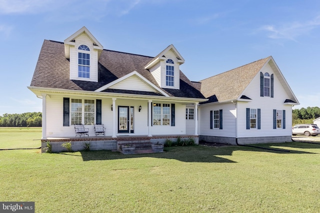 new england style home featuring a front yard