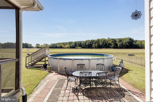 view of patio / terrace with a rural view